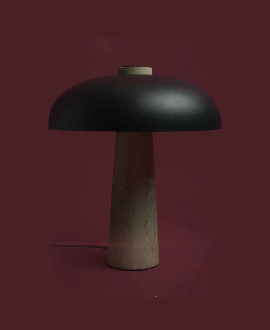 A tall black dome lamp. Unlit.